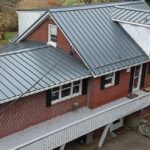 roof with grey metal standing seam panels